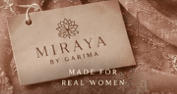 Miraya by Garima signature gold foil label on blush couture fabric